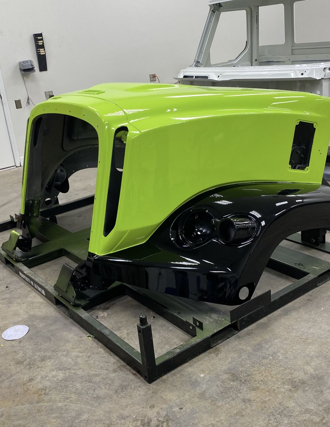 Lime green hood with black fenders, fresh out of the booth