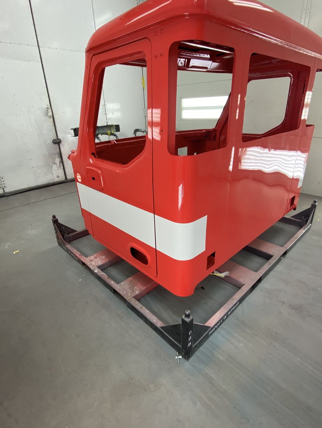 Red cab with a white stripe