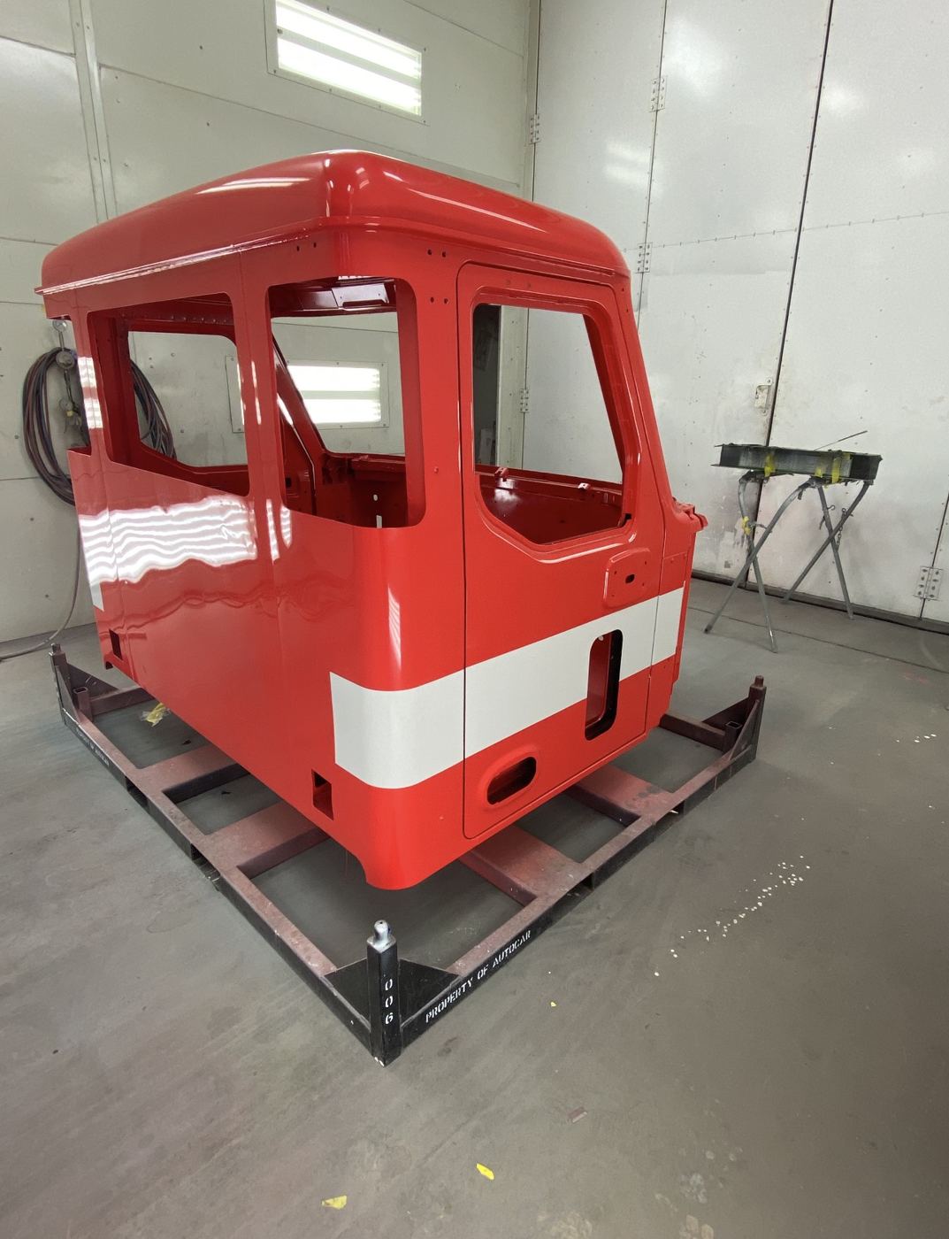 Red cab with a white stripe, other side