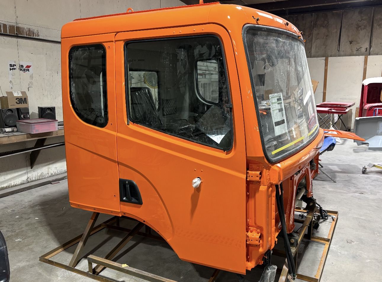 Orange cab on the stand after paint