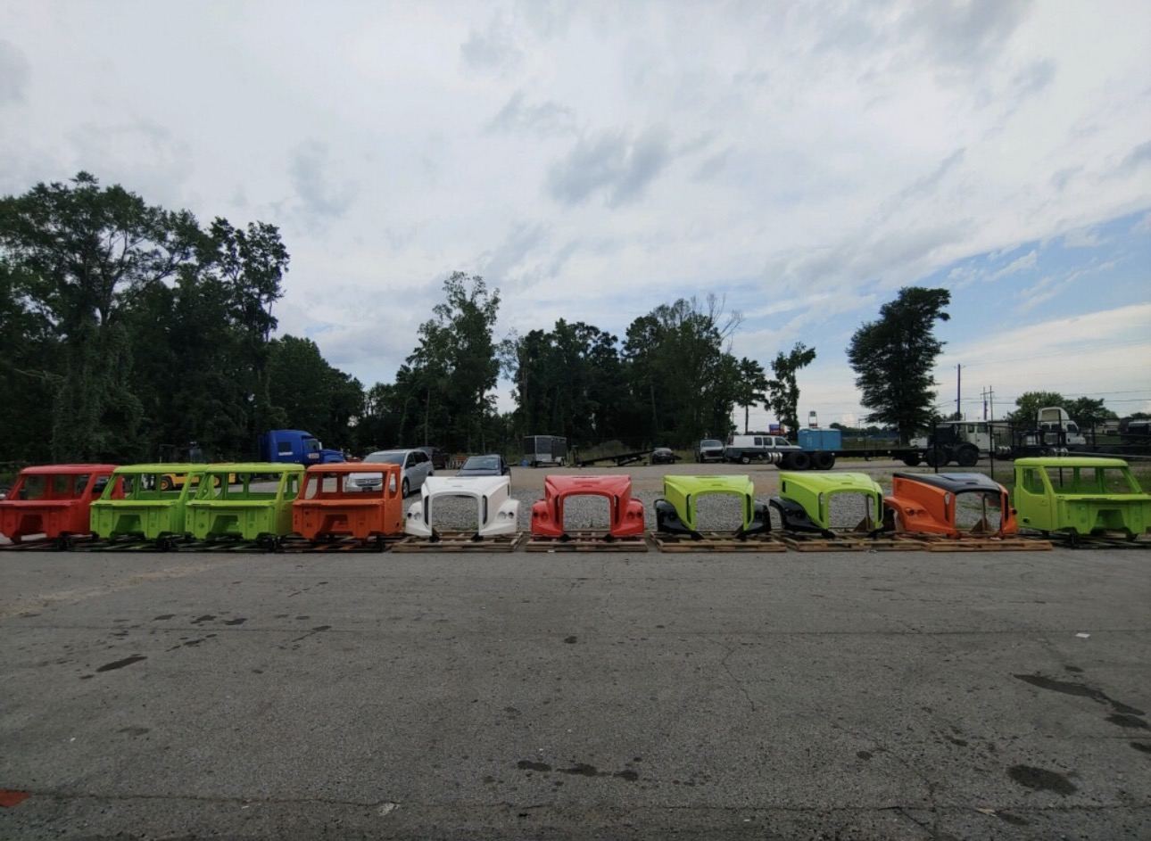 Cabs and hoods lined up in the yard